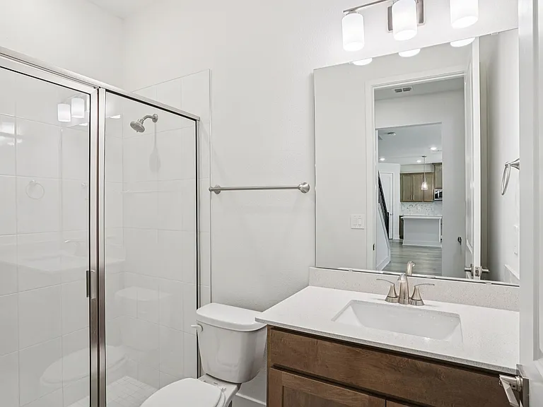 4th bathroom next to downstairs 5th bedroom