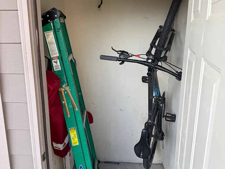 Large storage closet on front balcony. Keypad lock on closet