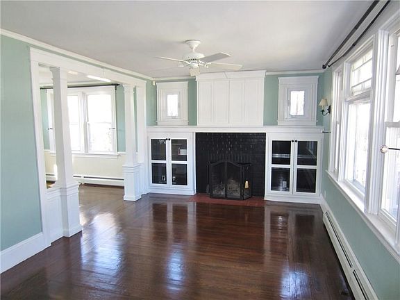 Double Parlor with Wood Burning Fire Place, Gleaming Hardwood Floors and Look at the Woodwork!