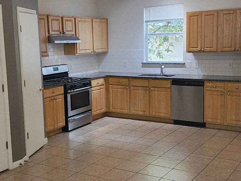 Kitchen area with pantry on left side