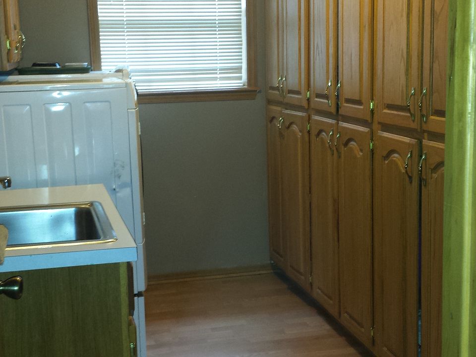 laundry with cabinets & sink