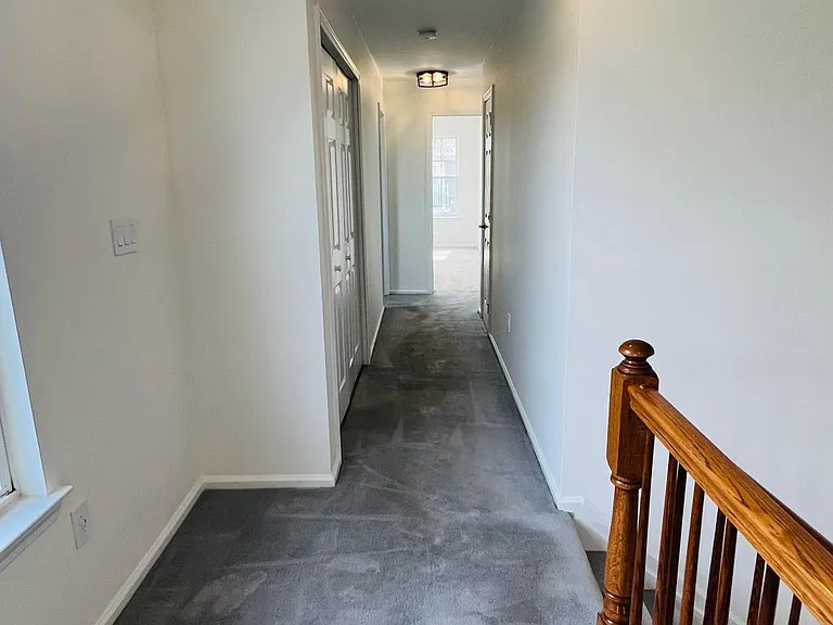 Hallway to guest bathroom and bedrooms and laundry