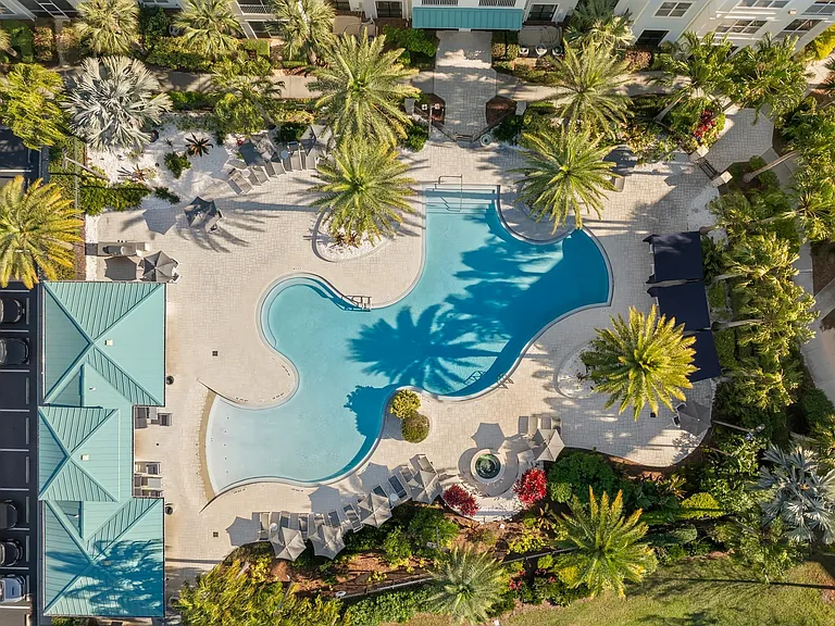 Experience elevated outdoor living with a resort-style pool, thoughtfully designed with lush greenery and serene lounging areas.