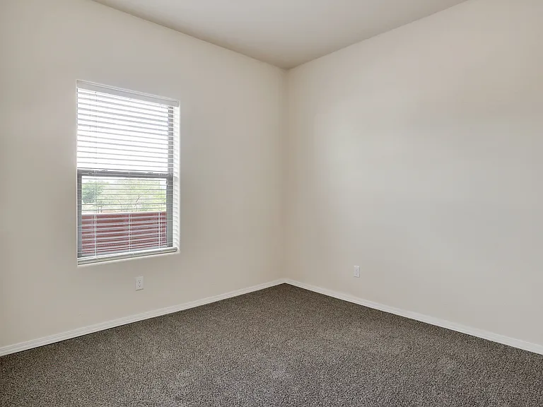 Unit 310 Bedroom has cozy carpeting