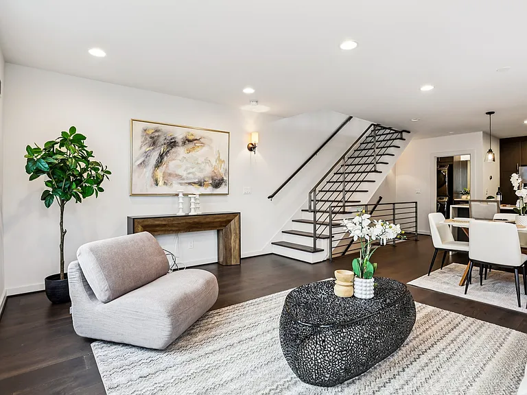 Sun-filled space for lounging and dining with hardwood floors.