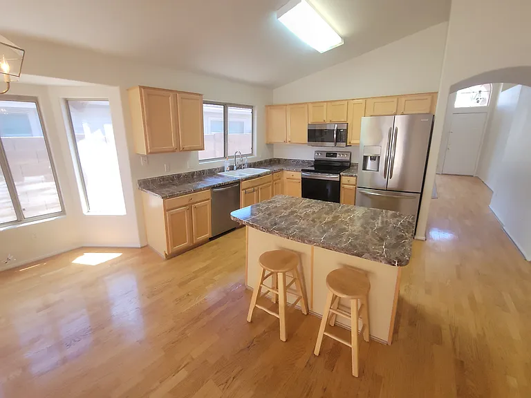 Kitchen w/ an island.