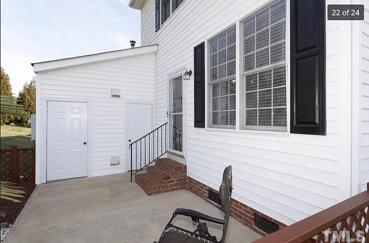 Back patio with storage room.