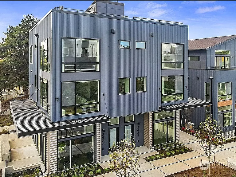 Rental unit and entrance on left side. 1st floor entrance, w/ living on floor 2 and 3 + rooftop deck.