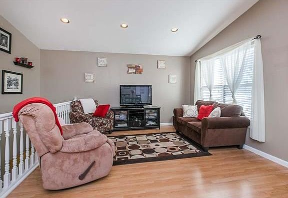 Open floor plan with can lighting and gorgeous floors.