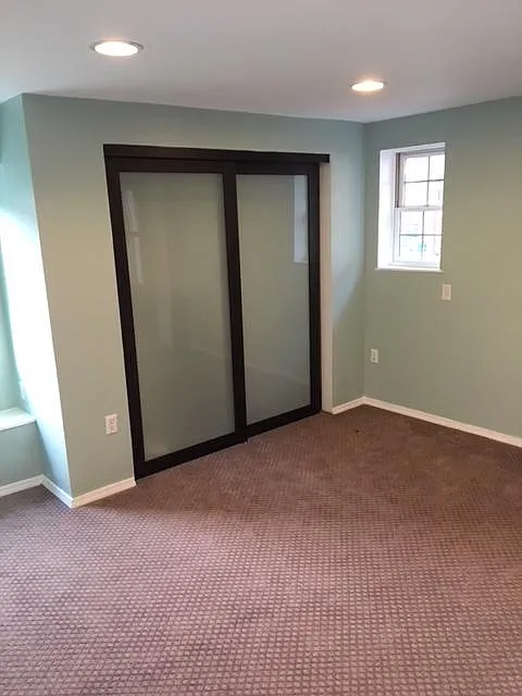 Large sunny bedroom with access to outdoor deck. - 658 W Forest Ave #3