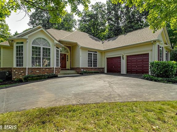 U shaped driveway with two car garage.