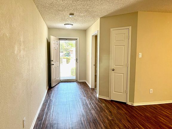 Entry way that leads into one of the two living areas and dining room. Space can be used as a study, gameroom, or playroom.