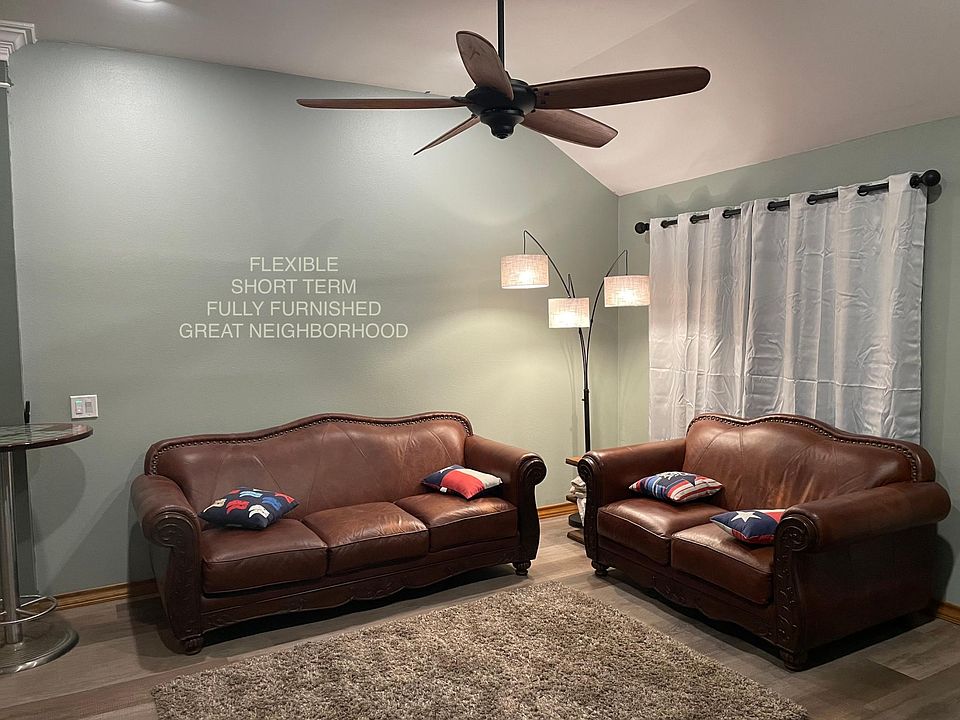 Open concept Living area High Ceilings Shag Rug, great lighting, surround sound, 70_ TV