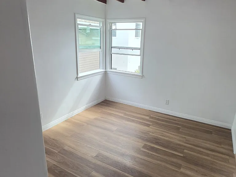 Bedrooms with new high end vinyl plank floors throughout apartment.