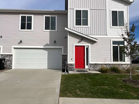 Front view of the entrance and 2 car garage. Spacious driveway