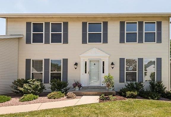 Pediment door system with double side lights has been freshly painted along with the window shutters.   Anderson screen door with roll up screen allows for easy transition during the seasons.  New Coach Lamps offer the perfect greeting for your guests.