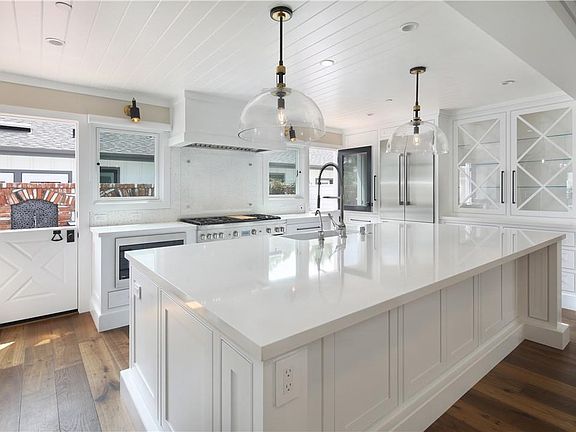 Beautiful kitchen with 2 dutch doors that open to backyard.