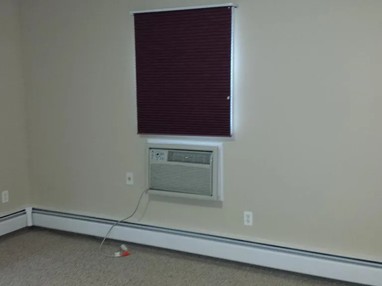 Room with a wall AC.