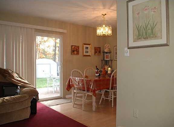 Dining room off kitchen w/ sliders to yard