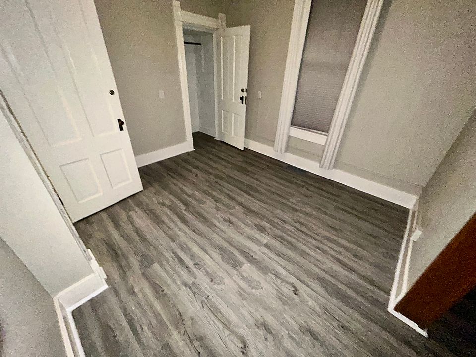 bedroom with two closet areas