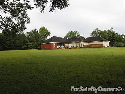 Rear view from shed
						:
						Big, open yard. Plenty of room for a swimming pool and a garden!!