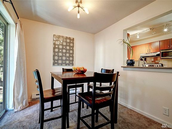 The dining room is open to the kitchen making for easy access when entertaining and creating an open concept space for all to connect. 