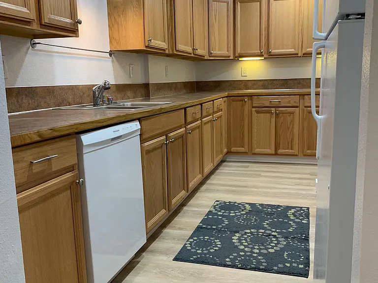 Lots of cabinets for storage. Newer dish washer.
