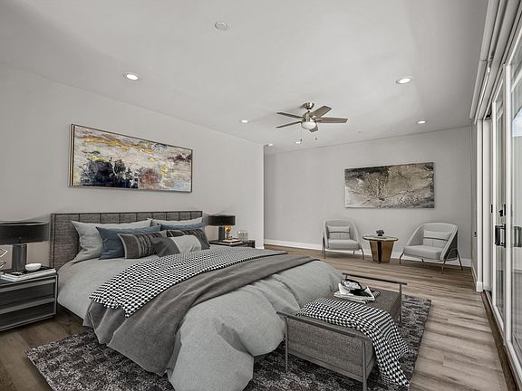 Master bedroom with modern vinyl floors and fresh paint