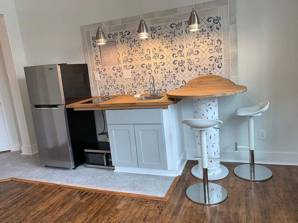 Shelves will be incorporated in the space where the microwave is located. Also shelves above the table and refrigerator