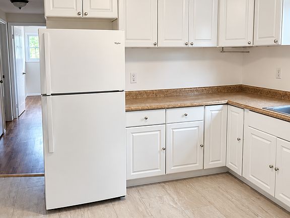 Kitchen w/ updated floors and cabinetry