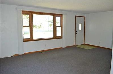 Garage. 4 car garage 47x19  200 amp electric. concrete floor, 2 car  door in front  with opener.  1 car door on side. Metal roof. Storage above