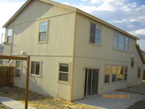 "Large patio and backyard is perfect for summerlong entertainment."