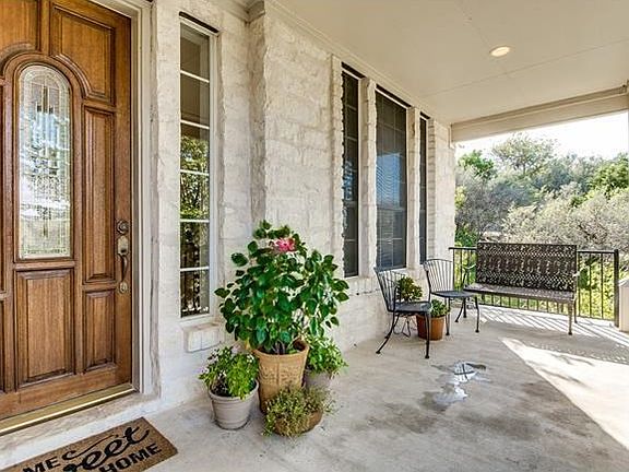 Covered front porch is a perfect spot to watch those Texas sunsets.