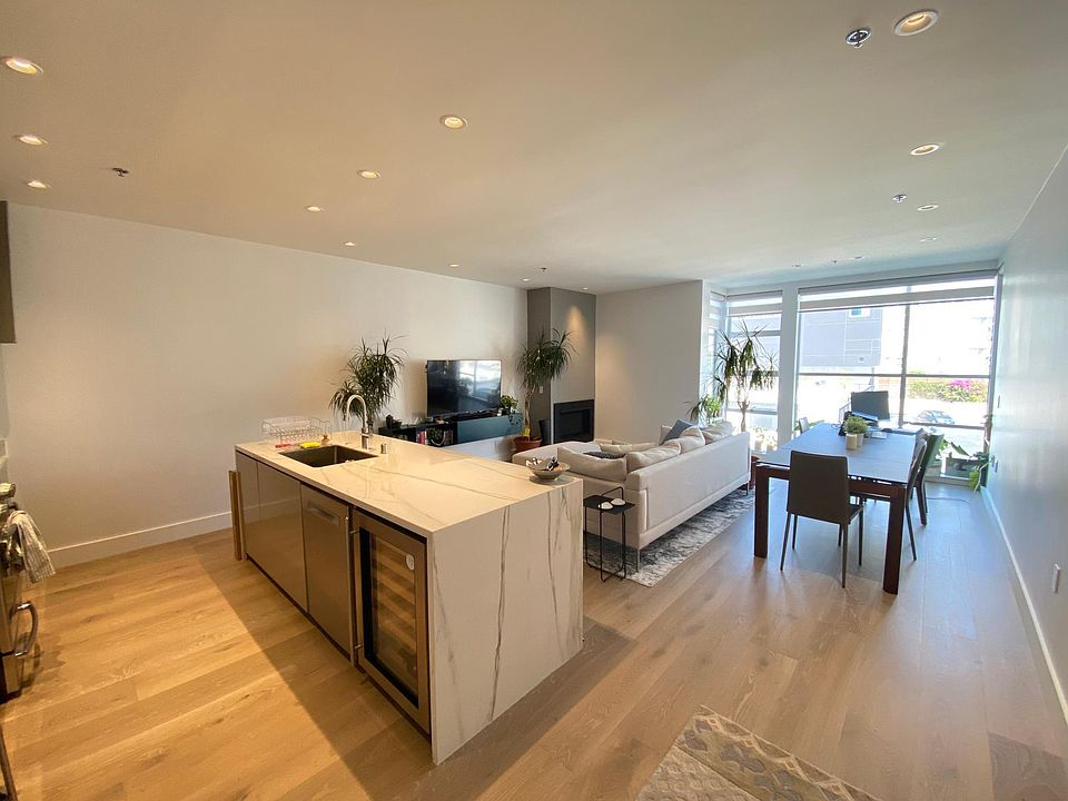 Open floor plan kitchen, living and dining space