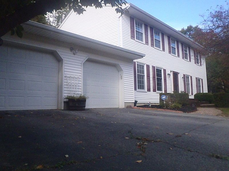Beautifully Landscaped : Additional paved parking for 3 cars.