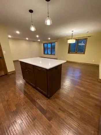 Large living and dining area with island.