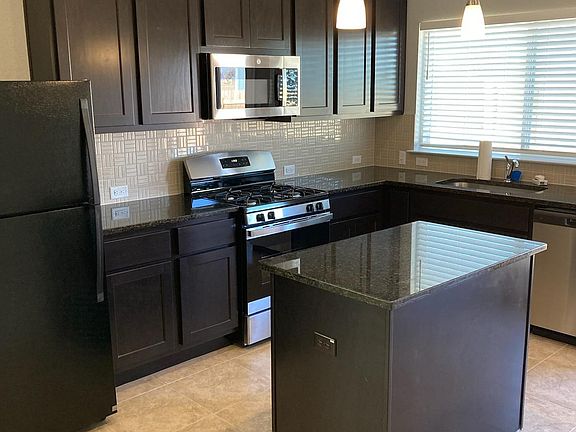 Builder's upgrade on cabinets and island. Very bright and airy kitchen