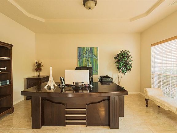 The office has a great location. It is very private and elegant and it features: Same porcelain 18x18 tile work, tray ceilings, 2 nice big windows. and French doors. This setting is conducive to productive work due to adequate lighting, privacy and n