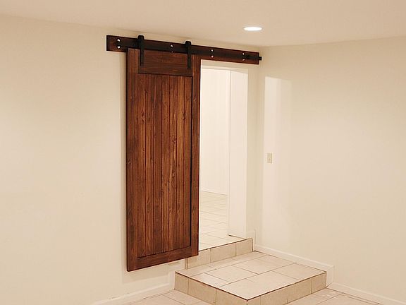 Large master suite ( 25x15) with full bathroom and walk-in closet. Complete with new barn doors