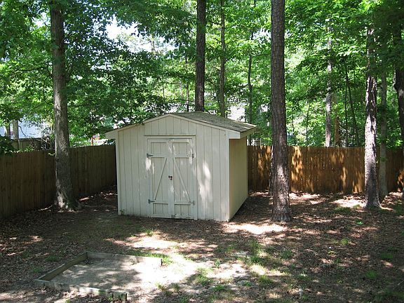 shed and 6'tall pressure treated fence