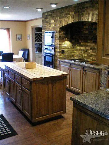 Large, well-designed kitchen offers enough space for the whole family to gather. Ovens and dishwasher have been upgraded to stainless steel since this photo was taken.