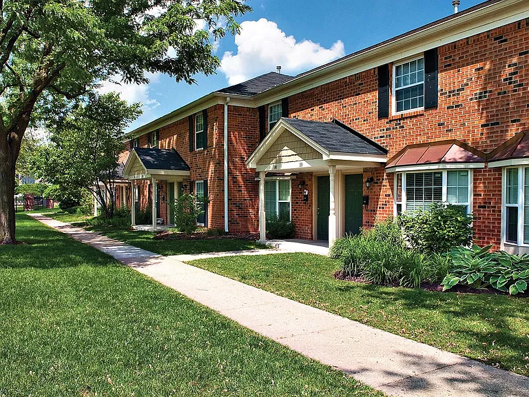 Great brickwork facade and groomed landscaping