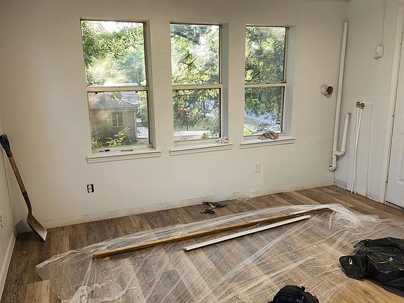 Kitchen (excuse the mess. currently being painted.) Washer and Dryer combo unit goes in corner where pipe is located.