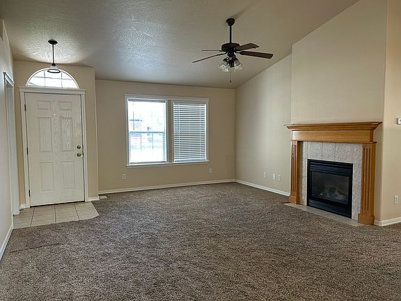 Living from the front door showing the gas fireplace.