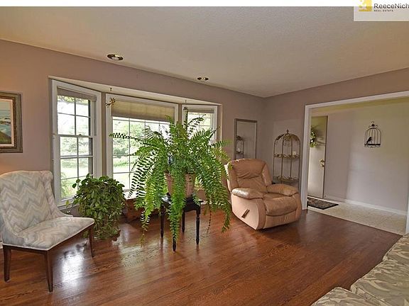 Marble entry leads to spacious living room with bay window