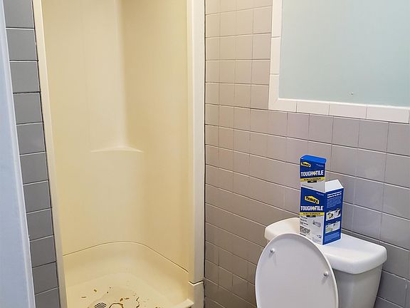 Shower floor being worked on now...will be fixed.