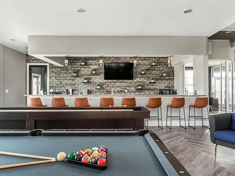 Game night, work-from-here days, and low-key hangs_our resident lounge has billiards, shuffleboard, coffee, and kitchen space.