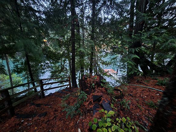 View of high-bank stairs and boat dock below on Fletcher Bay.