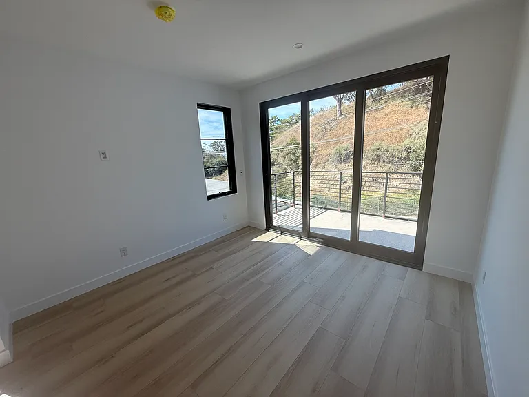 Downstairs office/bedroom with private balcony and peek-a-boo ocean views