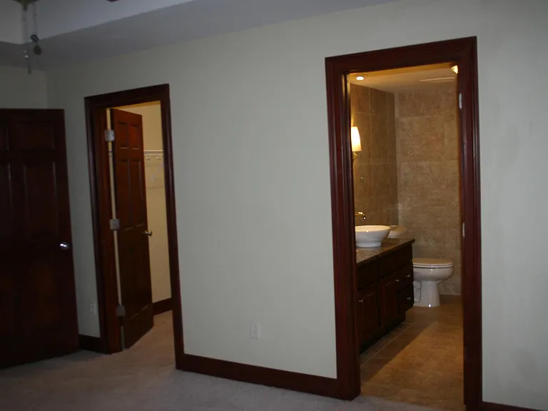 Main bedroom closet and full bath with jetted tub.